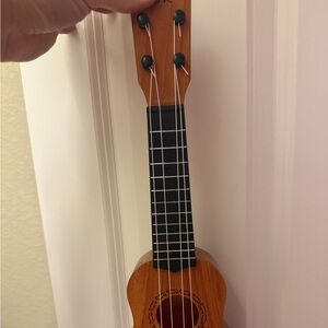 Wooden Ukulele with Black Strings